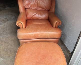 PAIR OF LEATHER CHAIRS WITH MATCHING OTTOMANS