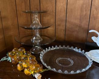 Lucite grape cluster; Heisey Glass Gardenia Bowl;  Graduated Cake Plates