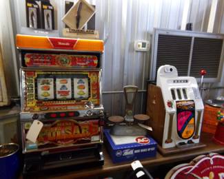 Slot machines, one electronic and one an old manual that is a nickel slot. AC Delco Shop cabinet for hose clamps, old scale that works 
