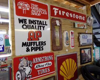 AP Mufflers sign, Armstrong Tires repop sign and other small signs 