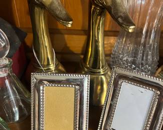 Brass ducks and picture frames