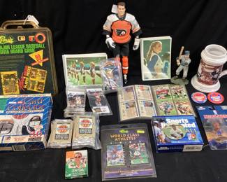 ASSORTED SPORTS CARDS, TOYS, ERIC LINDROSS HOCKEY ACTION FIGURE, ARK MESSIER MUG, MLB TRIVIA BOARD GAME, ESSO PIT CREW PINS, NASCAR CARDS, DALLAS COWBOY CHEERLEADER SET, ORIGINAL CHARLOTTE HORNETS HIVE FIVE, LJ, ALONZO, MUGSY BOGUES, KENDAL GILL PINS