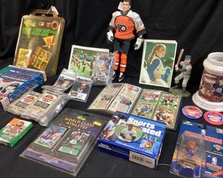 ASSORTED SPORTS CARDS, TOYS, ERIC LINDROSS HOCKEY ACTION FIGURE, ARK MESSIER MUG, MLB TRIVIA BOARD GAME, ESSO PIT CREW PINS, NASCAR CARDS, DALLAS COWBOY CHEERLEADER SET, ORIGINAL CHARLOTTE HORNETS HIVE FIVE, LJ, ALONZO, MUGSY BOGUES, KENDAL GILL PINS