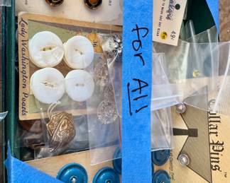 Assorted vintage and antique buttons on original cards, including mother-of-pearl, metal, and plastic. Includes some rhinestone-style decorative pieces and small jewelry findings. 