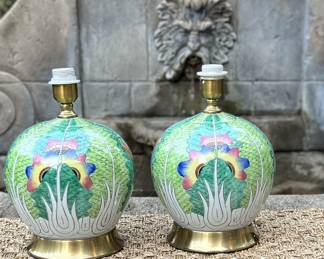 These hand-painted porcelain lamps feature a bold botanical motif rendered in rich greens, soft whites, and jewel-tone accents — a fresh reinterpretation of traditional Famille Verte styles. The layered leafy pattern is punctuated by stylized florals in vibrant hues, creating a look that feels both lush and modern.
Each lamp is crafted in Jingdezhen, China, the porcelain capital for over a thousand years. The design draws inspiration from classical Chinese symbolism, where lotus petals represent purity and rebirth, and vivid color was traditionally used to express joy and prosperity.
Hand-painted porcelain body
Brass base and fittings
No shades included
Available in multiple shapes and heights