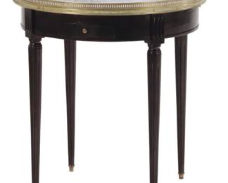French ebonized mahogany marble top bouillotte table having a bronze gallery, pull out slides and two drawers C 1940. 25.75"Diameter x 28"H