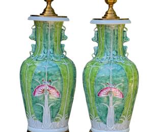 These hand-painted porcelain lamps feature a bold botanical motif rendered in rich greens, soft whites, and jewel-tone accents — a fresh reinterpretation of traditional Famille Verte styles. The layered leafy pattern is punctuated by stylized florals in vibrant hues, creating a look that feels both lush and modern.
Each lamp is crafted in Jingdezhen, China, the porcelain capital for over a thousand years. The design draws inspiration from classical Chinese symbolism, where lotus petals represent purity and rebirth, and vivid color was traditionally used to express joy and prosperity.
Hand-painted porcelain body
Brass base and fittings
No shades included
Available in multiple shapes and heights