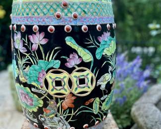Vintage Famille noire garden stool with crane and lotus motif.