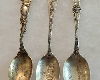 Many sterling silver souvenir spoons