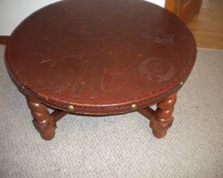 Leather top table with America depicted along with sailing related items 2 small cigarette burns hardly noticeable