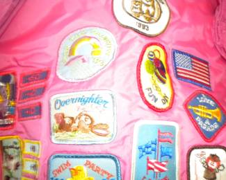 Vintage Girls Scouts patches on a wind breaker 