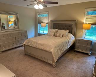 NEW LUXURY QUEEN 8 PIECE QUALITY BEDROOM SET. PLATINUM FINISH. INCLUDES DRESSER AND MIRROR, CHEST, VANITY WITH MIRROR AND BENCH. NIGHTSTANDS, PILLOW TOP MATTRESS WITH MATCHING HEADBOARD, FOOT BOARD AND SIDE RAILS. INCLUDES LAMPS AND COMFORTER.