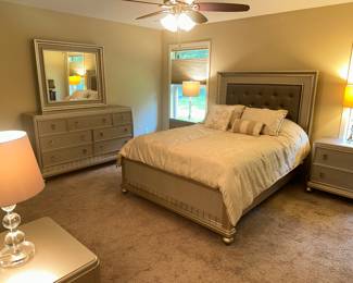 NEW 8 PIECE LUXURY QUEEN QUALITY BEDROOM SET. PLATINUM FINISH. SEE OTHER PHOTOS. SET INCLUDES DRESSER WITH MATCHING MIRROR, CHEST, QUEEN SIZE PILLOW TOP MATRESS WITH MATCHING HEADBOARD, FOOTBOARD AND SIDE RAILS, NIGHTSTANDS AND VANITY WITH MIRROR AND BENCH. LAMPS AND DESIGNER COMFORTER INCLUDED.