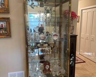 GOLD CHROME GLASS CURIO CABINET WITH LIGHTED, MIRRORED BACK, GLASS SHELVES