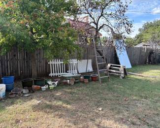fence, flower pots, buckets, ladder, saw horse