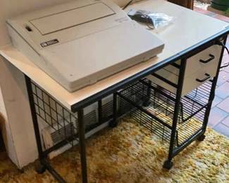 Vintage Typewriter With Toshiba Calculator On Top Of Vintage Work Desk With Outlets