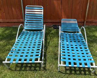 Two Blue And White Reclining Patio Chairs