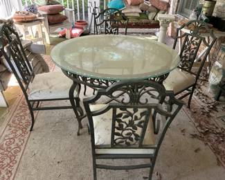 #89 Round Glass Table w/heavy metal base w/Heavy Metal Chairs (2 w/arms and 2 without) - 48x30 $150.00