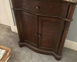 . . . marble-topped cabinet
