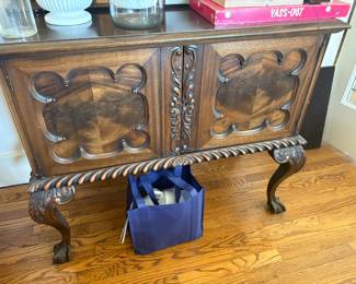 . . . and its matching ball-and-claw oak sideboard