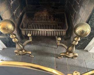 . . . unbelievable brass andirons and fireplace great