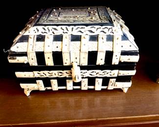 Bone mounted wooden casket