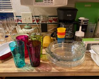 kitchenwares, including glass pie plates, Mr Coffee, Tupperware cups, chopper