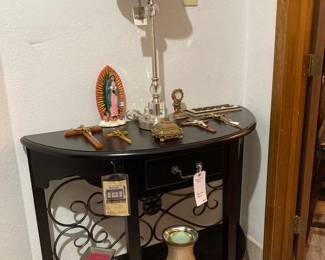 black demilune table, Scentsy melters, crucifixes