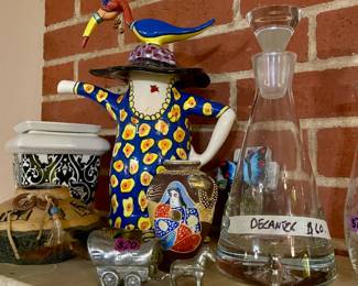 some tea pots and crystal decanters