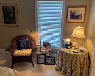 Wicker chair, picture frames, lamp, artwork