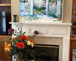 Artwork by Hung Pham, copper coal hod, picture frames, floral arrangement