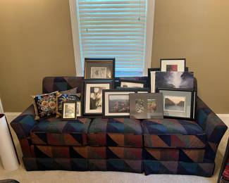 Sleeper sofa, framed photographs