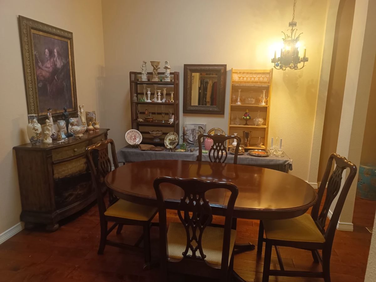Elegant dining set with painted buffet and glassware