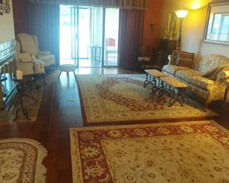 A room of rugs and fine furniture