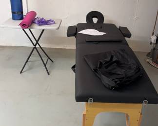 Professional Portable Massage Table 2 Yoga Mats And A Plastic Side Table 