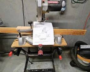 CRAFTSMAN 10 Compound Miter Saw with Laser Guide on Black Decker Workmate Stand