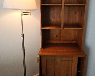 Honey Colored Cabinet And Chrome Standing Lamp. 