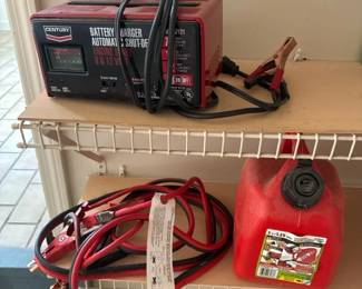 Battery Charger Jumper Cables And A 1.25 Gallon Gas Can 