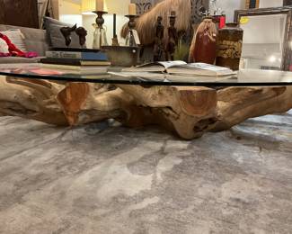 Glass and tree trunk coffee table - 6ft wide and 1ft tall - $2,200 + tax. 
