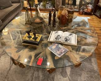 Glass and tree trunk coffee table - 6ft wide and 1ft tall - $2,200 + tax. 