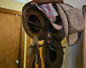 lots of western hats and rustic hat rack