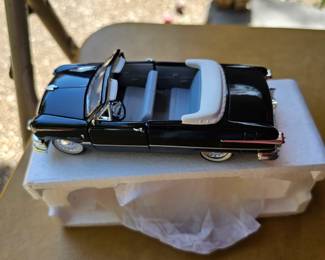 several smaller size die cast cars in box