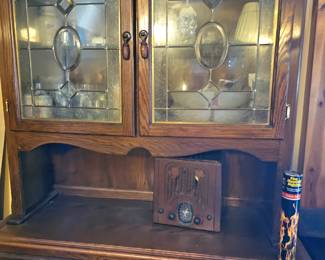 Farmhouse style vintage cabinet with bevel lead glass doors