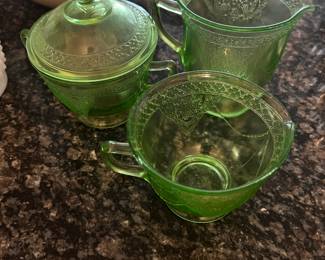 Could be uranium glass. 3- piece set