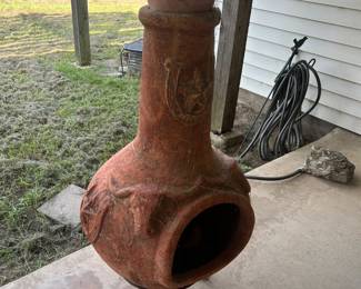 A chiminea is an outdoor stove, typically made of terracotta clay,