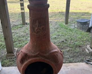 A chiminea is an outdoor stove, typically made of terracotta clay,