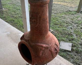 A chiminea is an outdoor stove, typically made of terracotta clay,
