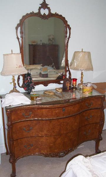 50"L x 23"W x 34 1/2"H to top of dresser, 45"H to top of mirror, mirror is 30"w
French burled walnut dresser