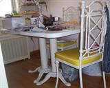 White iron table with double pedestal base and 4 chairs