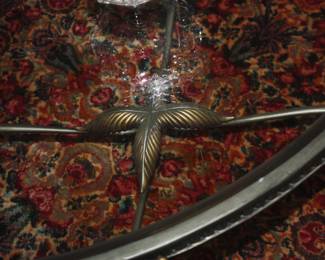 Oval glass top coffee table leaf motif
